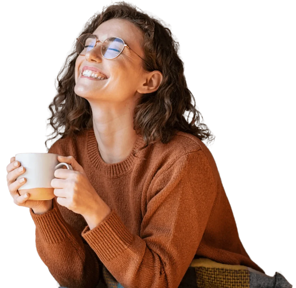 Happy woman with coffee cup, representing relaxation and joy during counseling
